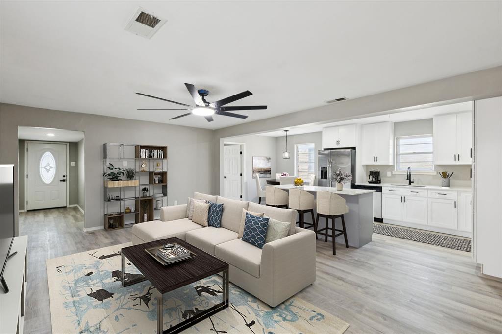 9643 Altacrest Drive Dallas, TX 75227 - Photo 5 of 30 a living room with furniture kitchen view and a window
