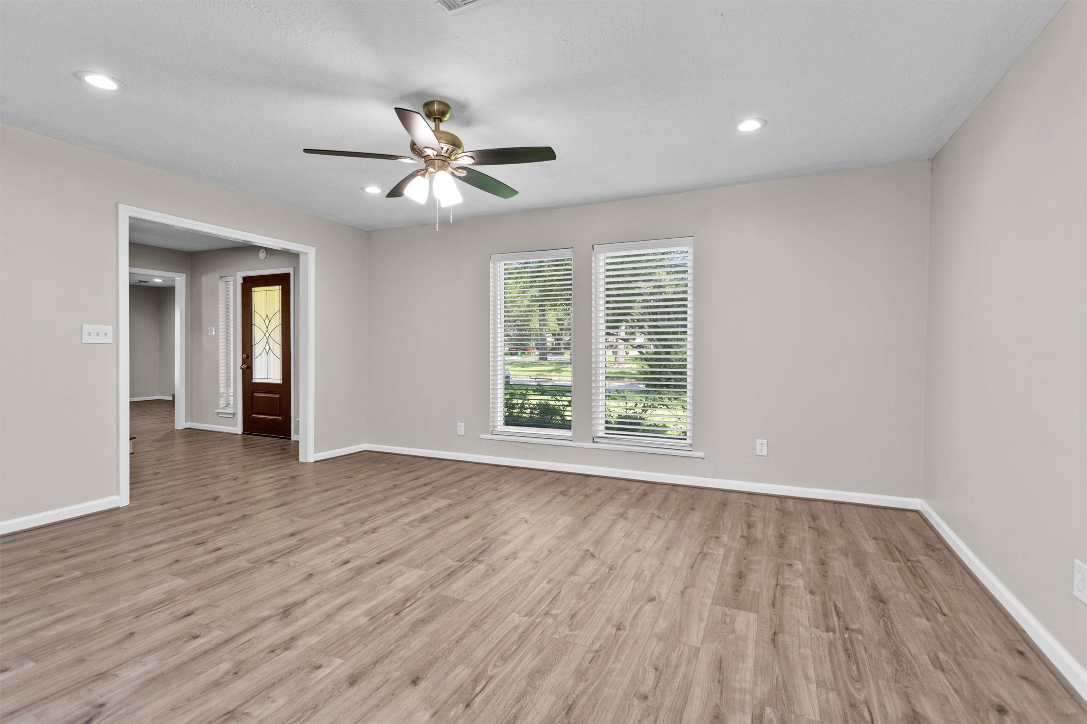 9115 Godstone Lane Spring, TX 77379 - Photo 8 of 46 This spacious, light-filled room offers versatile potential as a formal living area or a stylish home office, perfect for modern living.