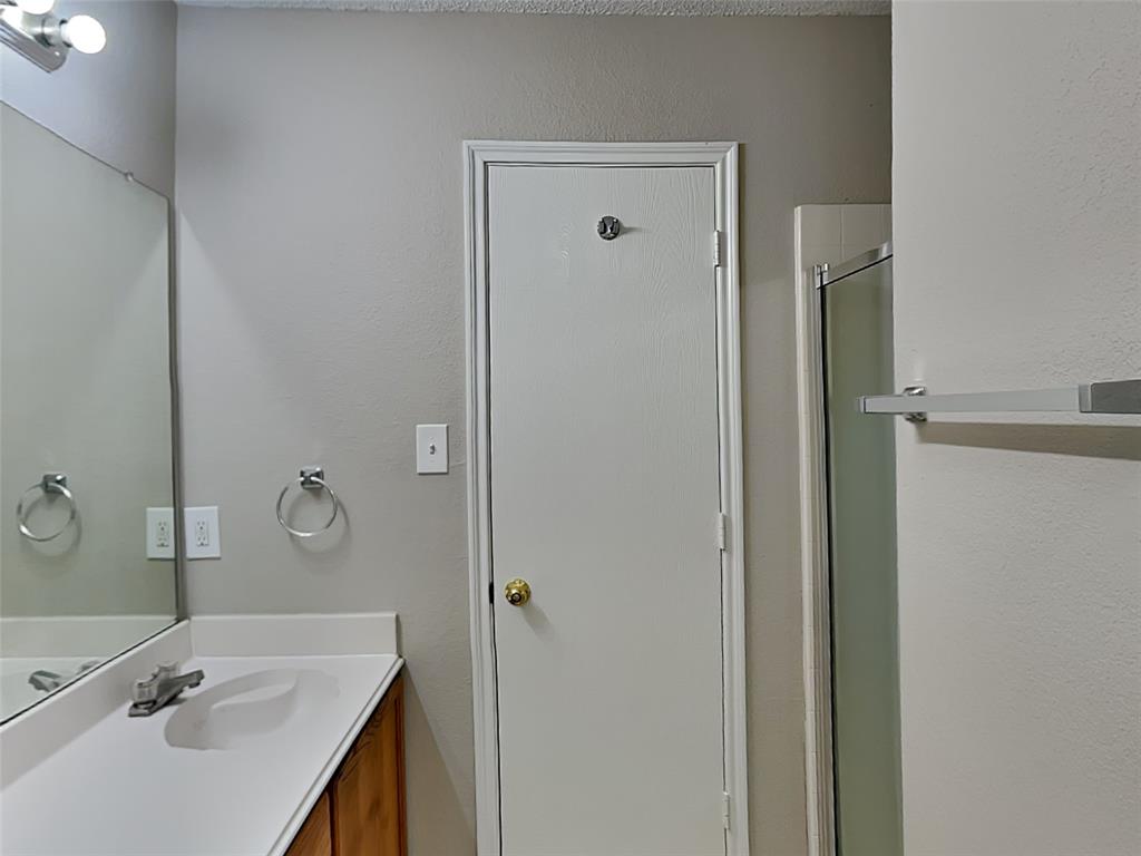 7413 Ranger Way Fort Worth, TX 76133 - Photo 9 of 19 a bathroom with a sink and mirror with toilet