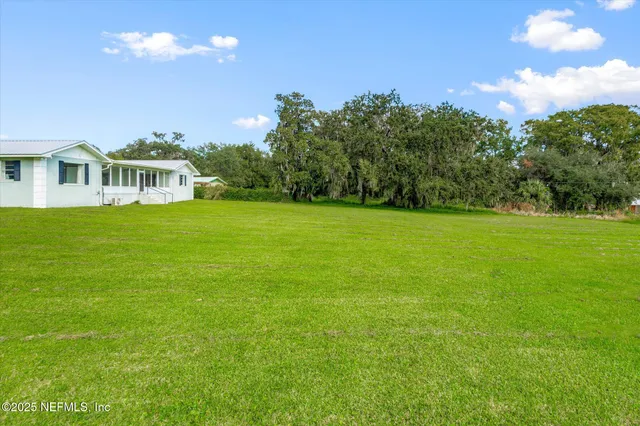 a view of a house with garden and plants