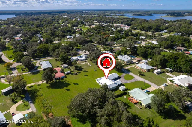 an aerial view of residential house with outdoor space