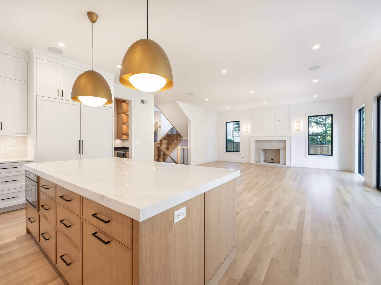 410 Prairie Avenue Wilmette, IL 60091 - Photo 11 of 44 a kitchen with cabinets a island and a chandelier