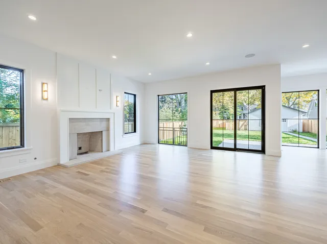 a bathroom with a granite countertop sink mirror and shower