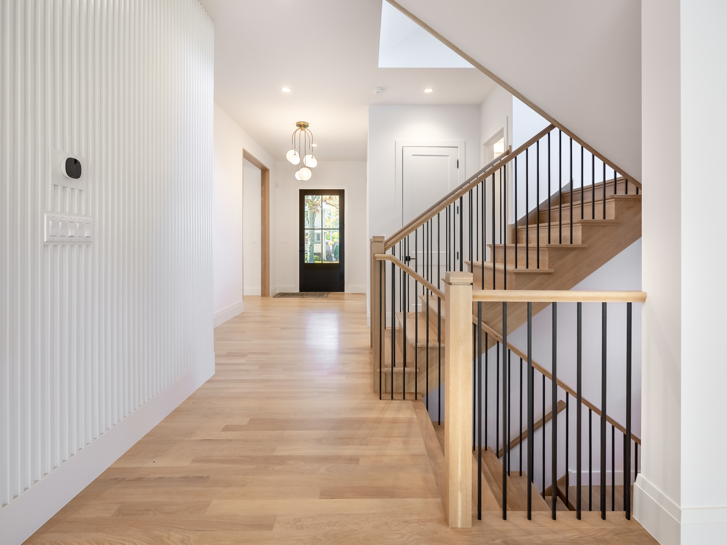 410 Prairie Avenue Wilmette, IL 60091 - Photo 15 of 44 a view of a hallway with wooden floor and entryway
