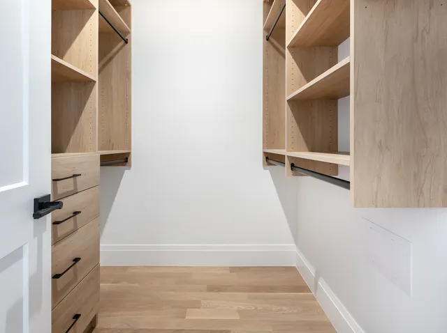 a white bath tub sitting next to a toilet
