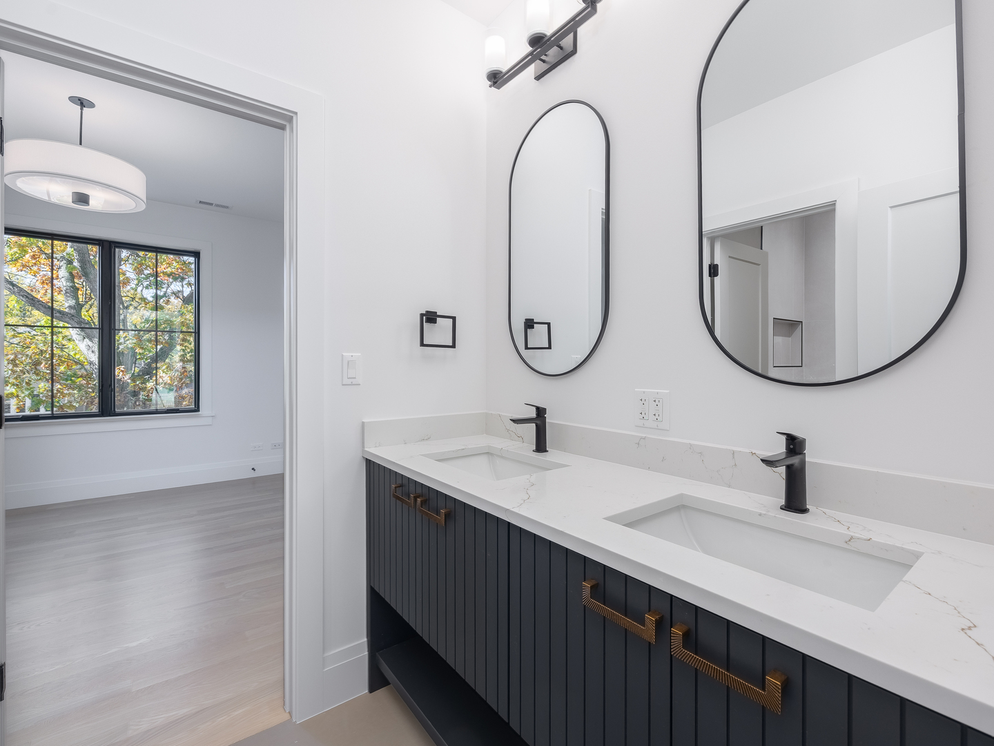 410 Prairie Avenue Wilmette, IL 60091 - Photo 26 of 44 a bathroom with a sink and a mirror