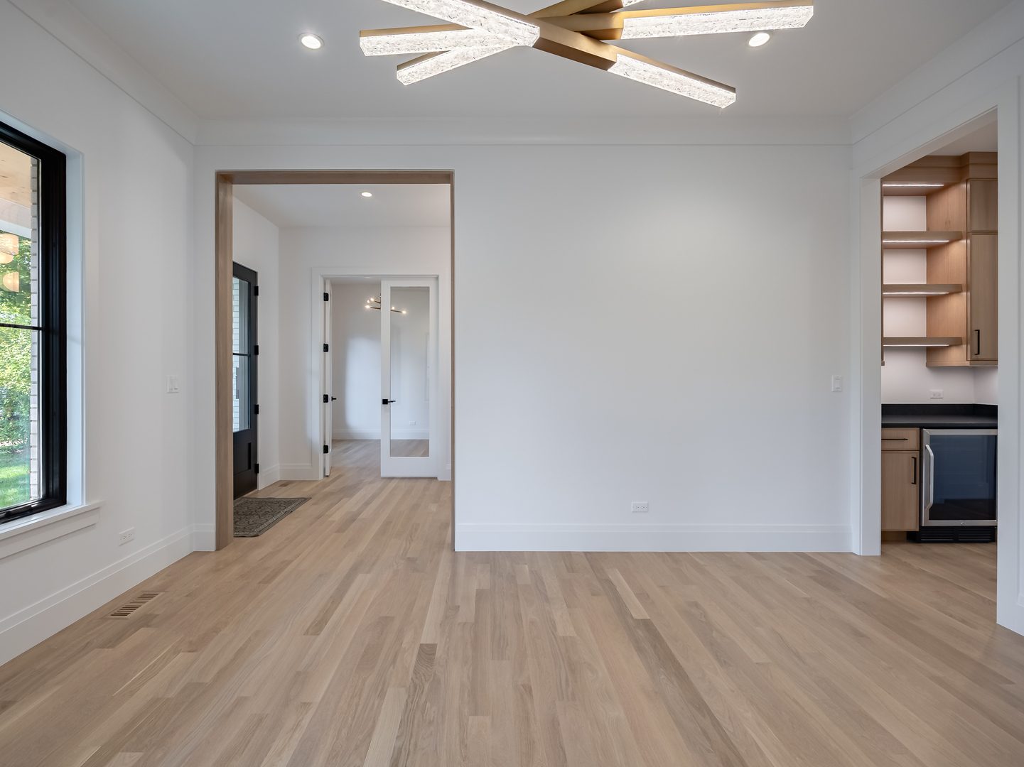 410 Prairie Avenue Wilmette, IL 60091 - Photo 5 of 44 wooden floor in an empty room and a window