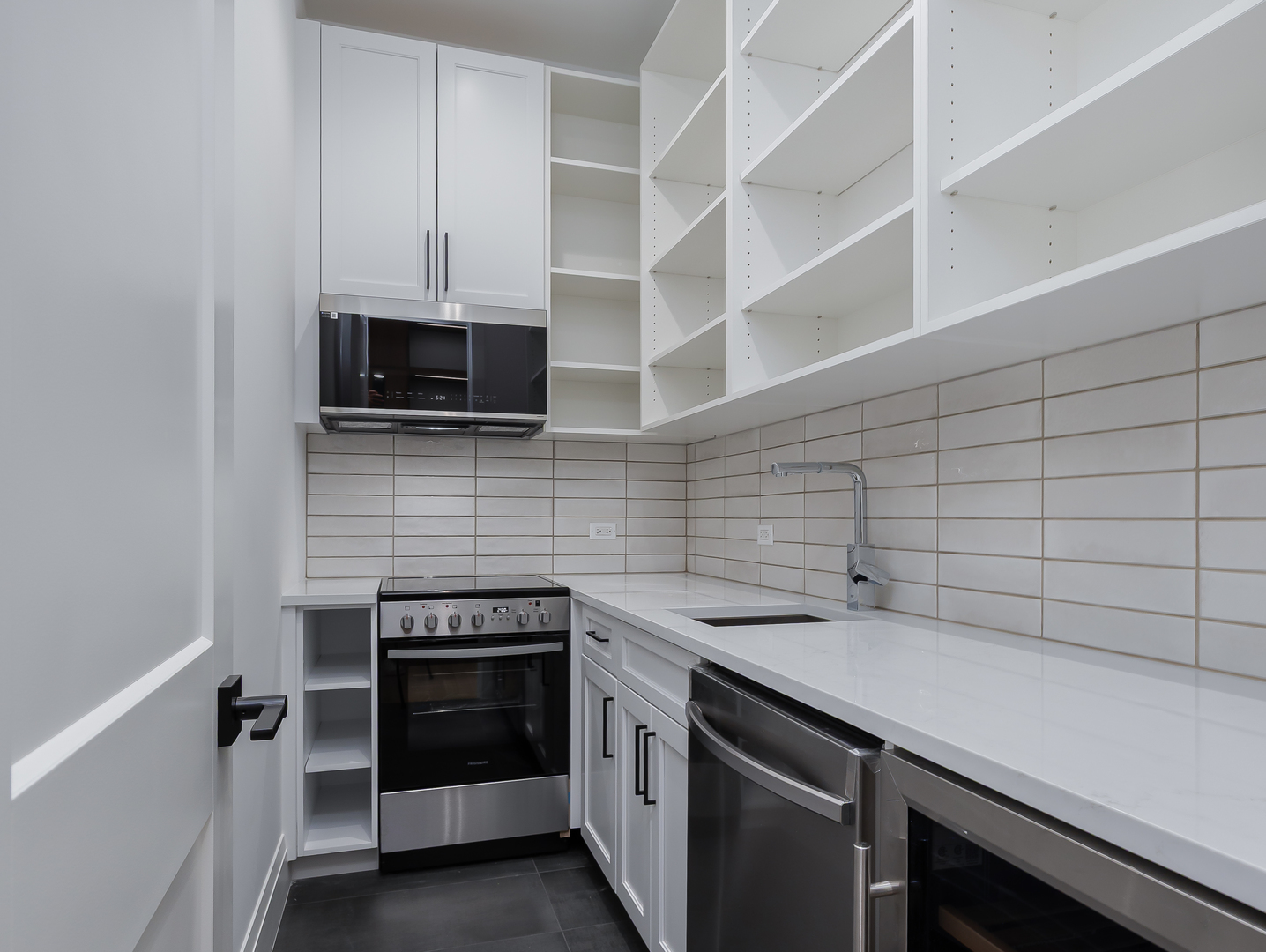 410 Prairie Avenue Wilmette, IL 60091 - Photo 7 of 44 a kitchen with a stove and a microwave