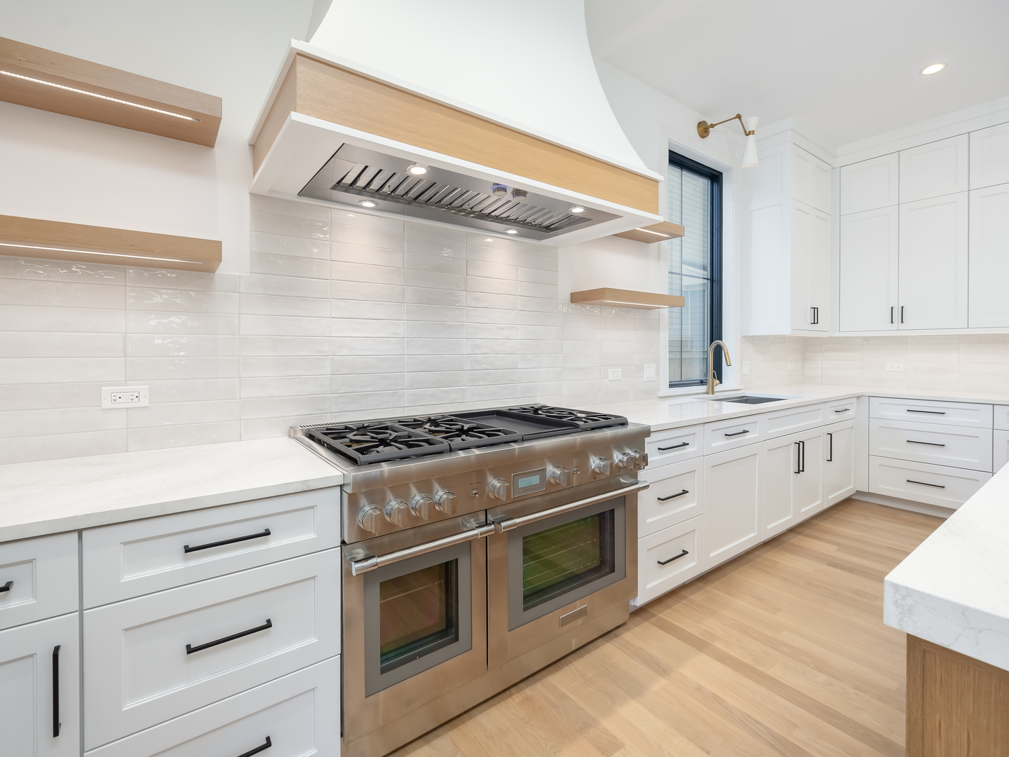 410 Prairie Avenue Wilmette, IL 60091 - Photo 8 of 44 a kitchen with white cabinets and appliances