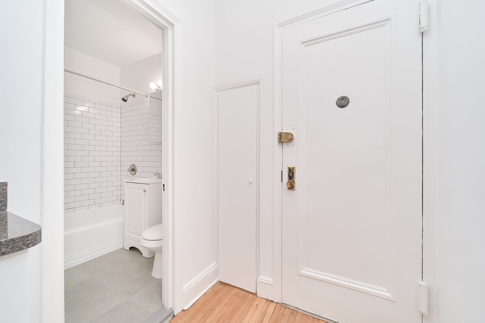 338 East 53rd Street, Unit C Manhattan, NY 10022 - Photo 4 of 10 a bathroom with a granite countertop toilet