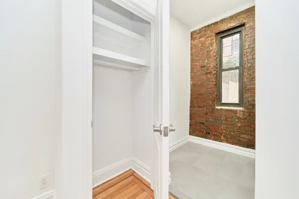 a view of a room that has a window in it