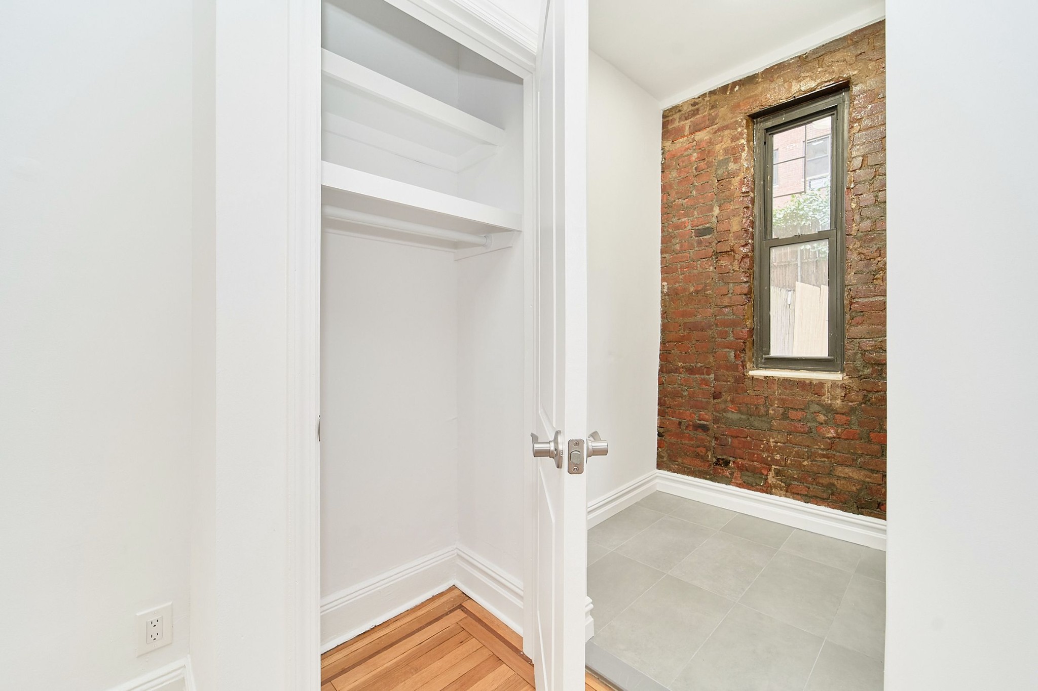 338 East 53rd Street, Unit C Manhattan, NY 10022 - Photo 5 of 10 a view of a room that has a window in it