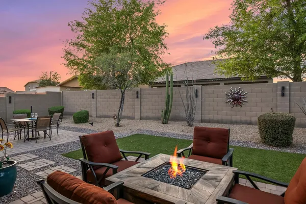 a view of a backyard with furniture
