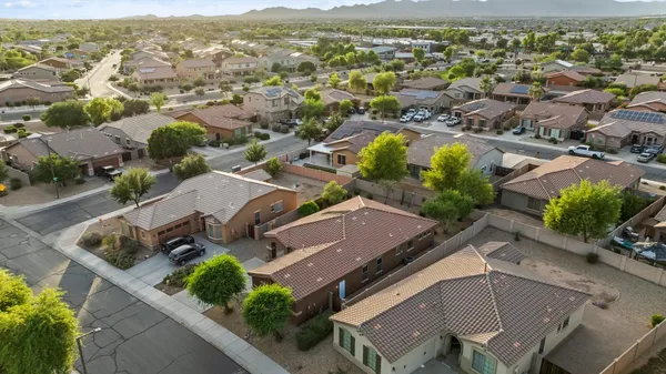 an aerial view of residential houses with outdoor space