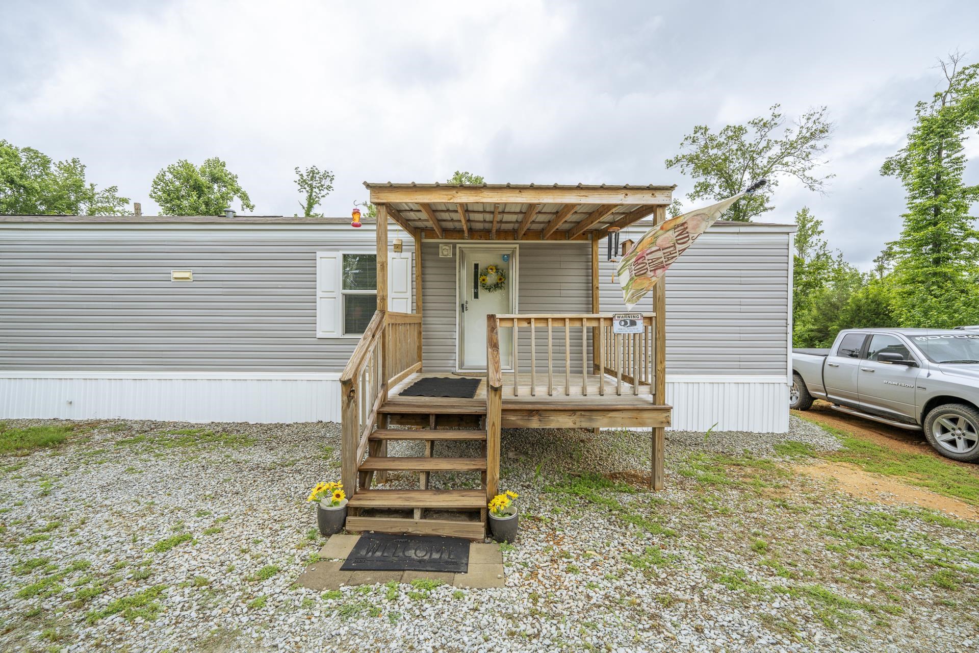 3275 Glendale Road Adamsville, TN 38310 - Photo 5 of 39 a view of a house with backyard and sitting area