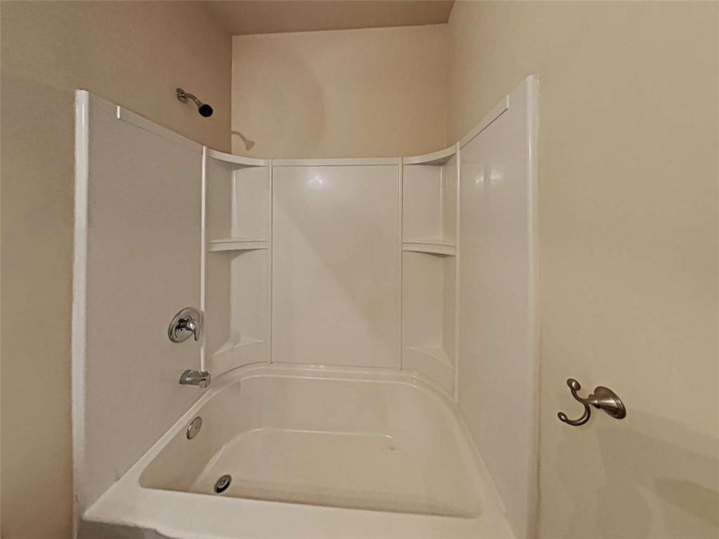 557 Scotland Drive Dallas, GA 30132 - Photo 16 of 28 a bathroom with a bathtub