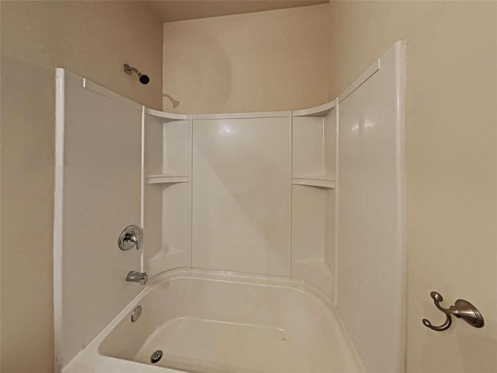 557 Scotland Drive Dallas, GA 30132 - Photo 17 of 28 a bathroom with a bathtub