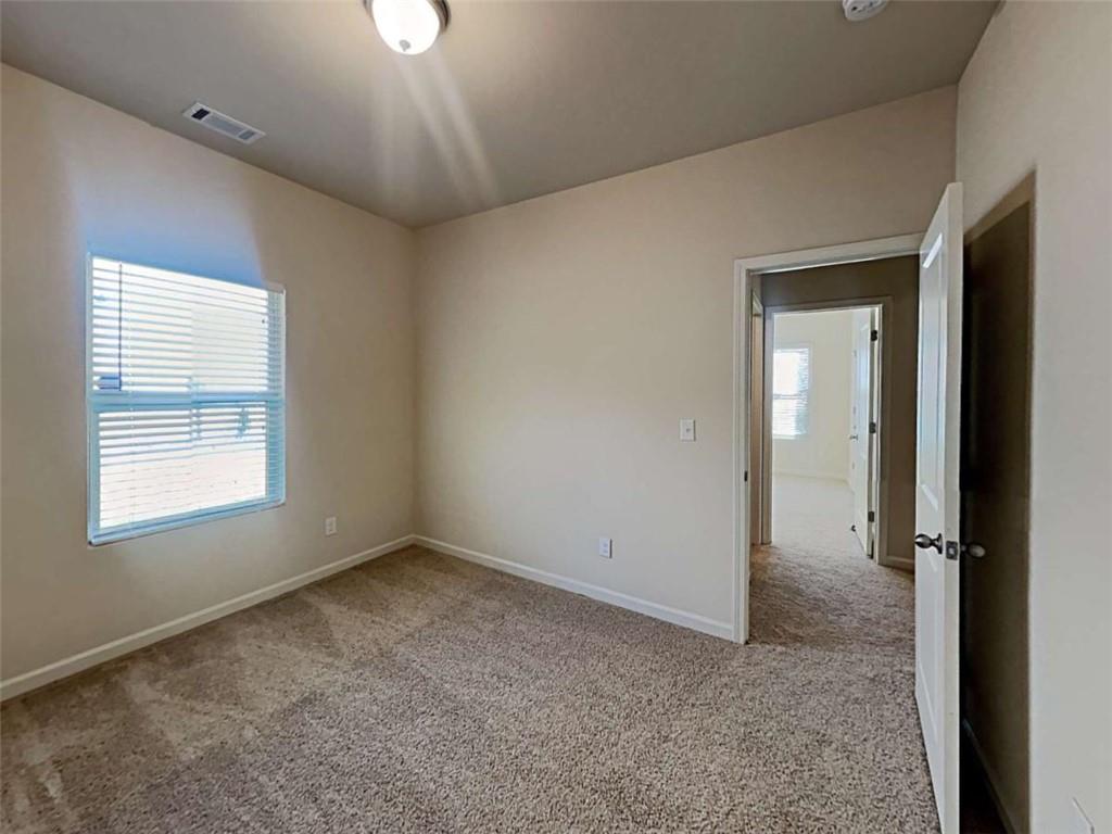557 Scotland Drive Dallas, GA 30132 - Photo 18 of 28 a view of an empty room with a window