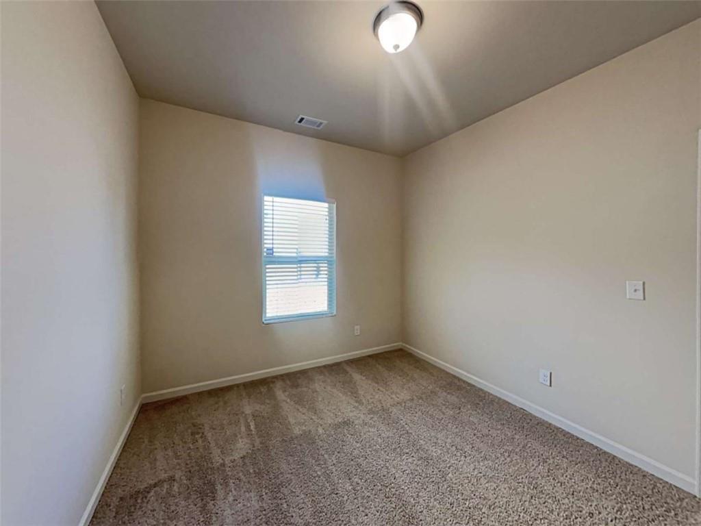 557 Scotland Drive Dallas, GA 30132 - Photo 19 of 28 an empty room with a window