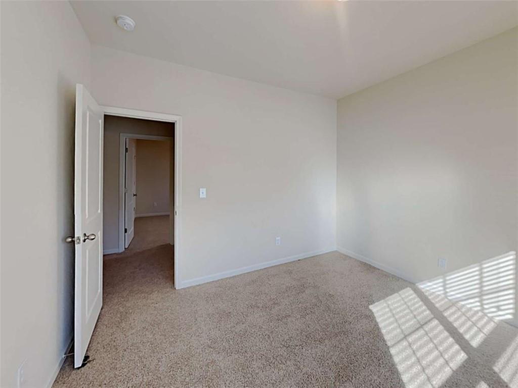 557 Scotland Drive Dallas, GA 30132 - Photo 21 of 28 a view of an empty room and window