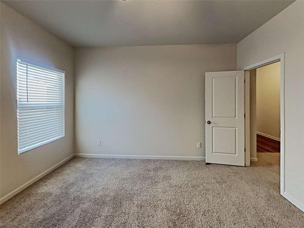 557 Scotland Drive Dallas, GA 30132 - Photo 23 of 28 an empty room with windows and closet