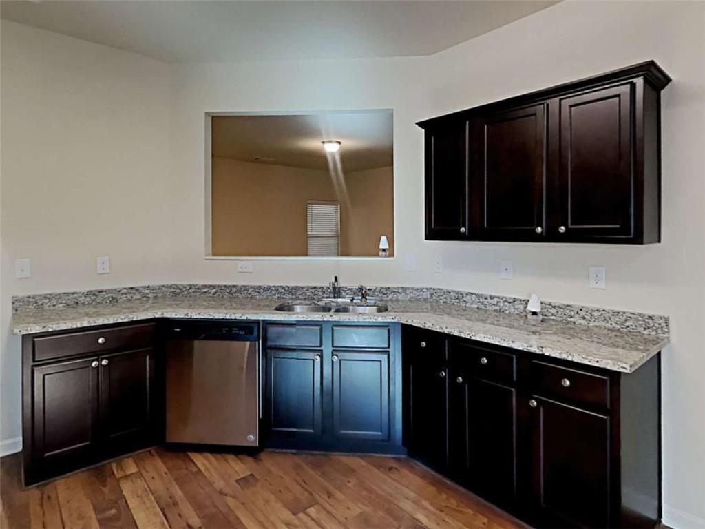 557 Scotland Drive Dallas, GA 30132 - Photo 24 of 28 a kitchen with a sink and a stove
