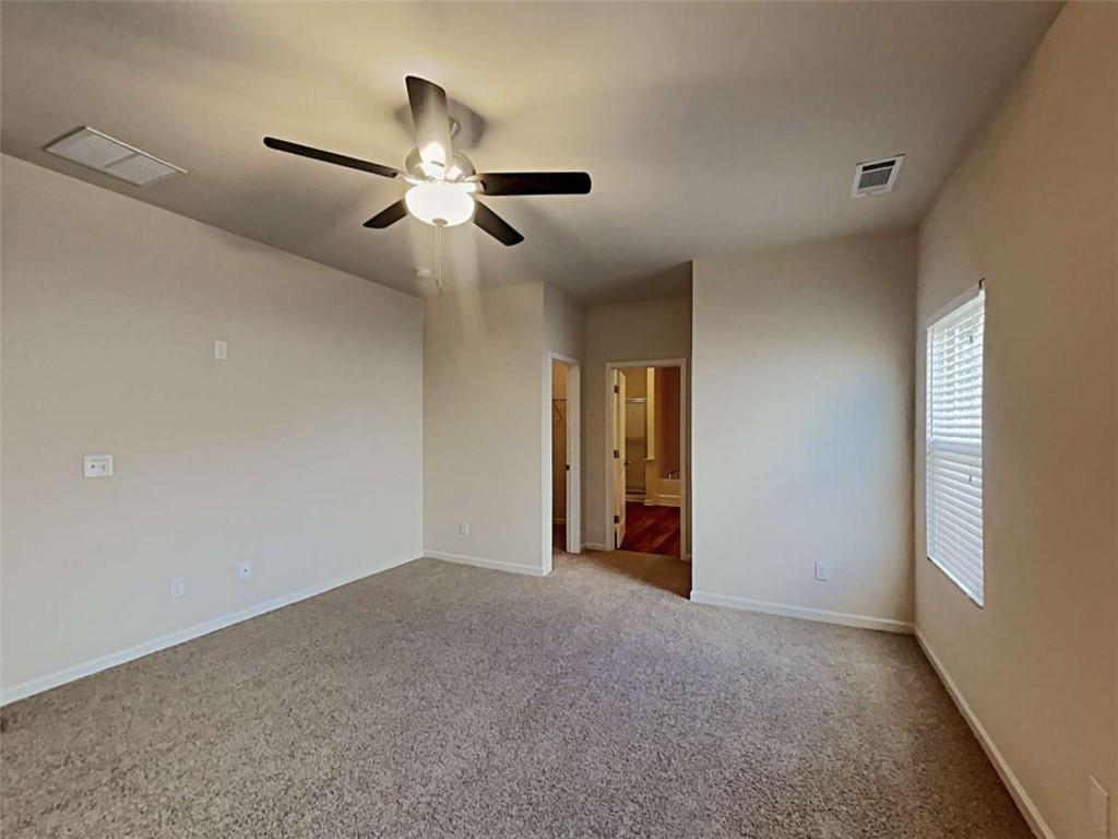 557 Scotland Drive Dallas, GA 30132 - Photo 5 of 28 a view of empty room with ceiling fan