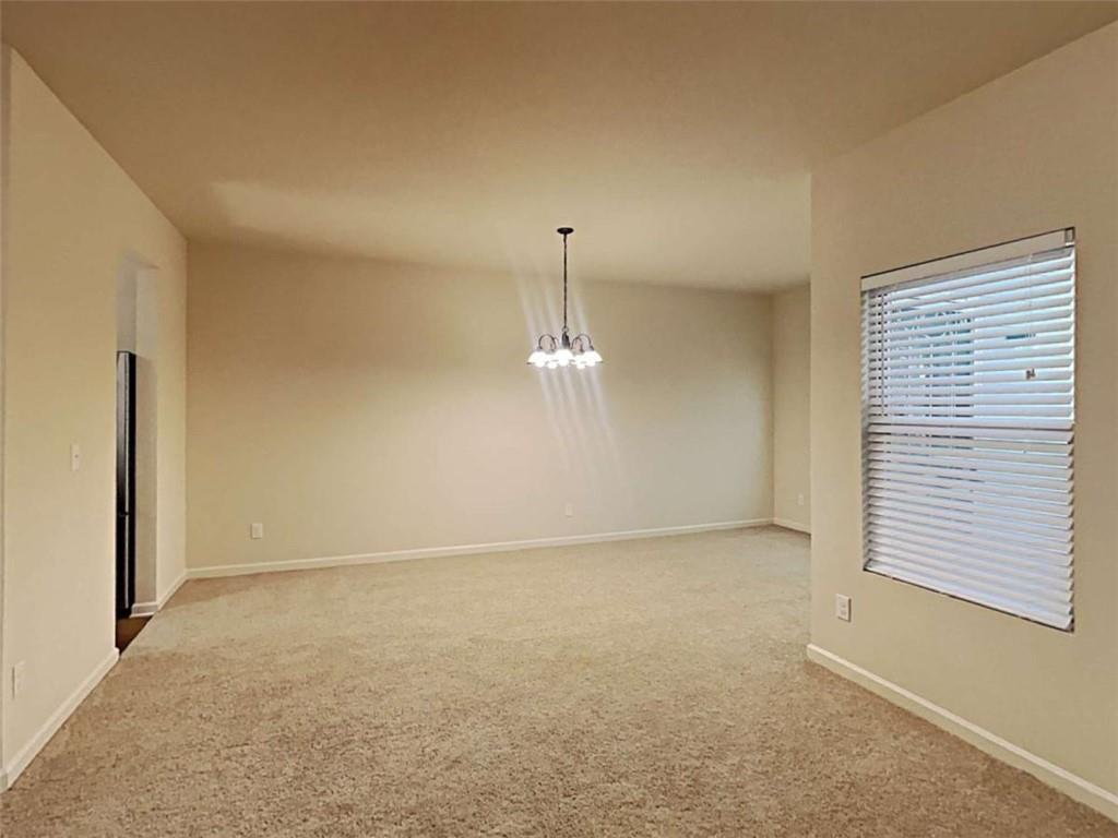 557 Scotland Drive Dallas, GA 30132 - Photo 8 of 28 an empty room with windows