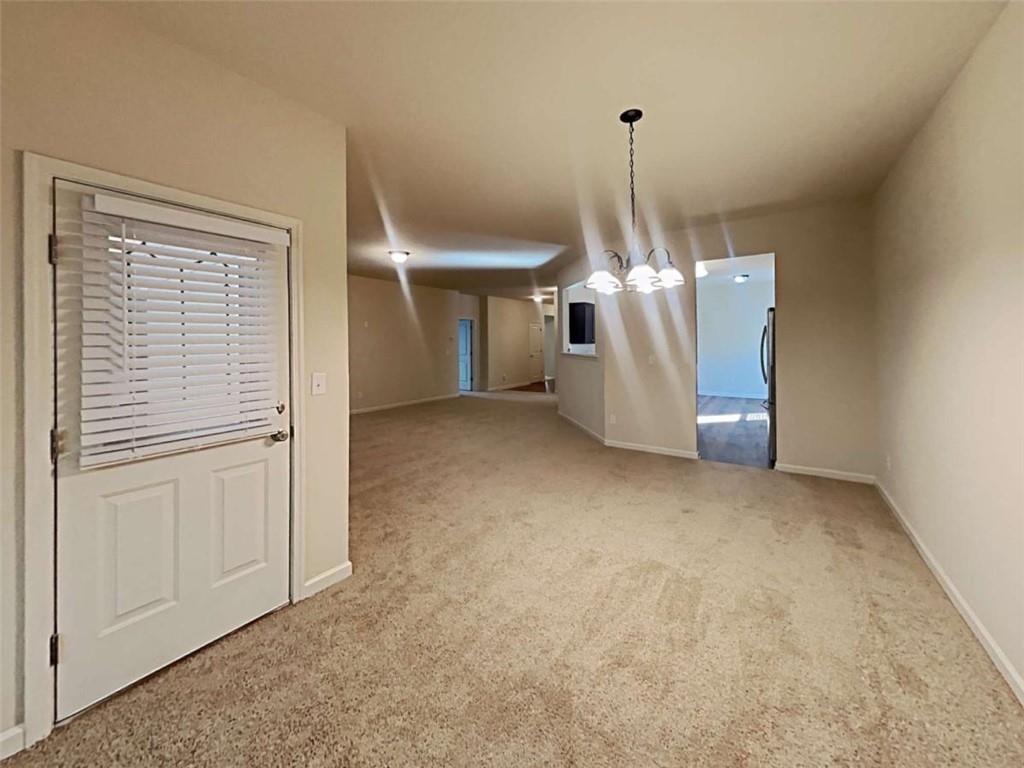 557 Scotland Drive Dallas, GA 30132 - Photo 9 of 28 a view of a livingroom with chandelier