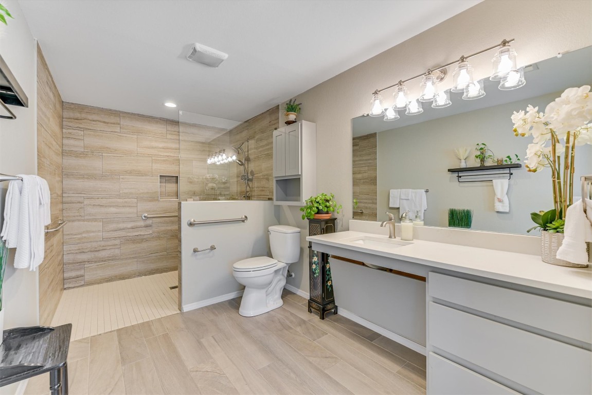 2201 Tallow Court Austin, TX 78744 - Photo 13 of 21 a bathroom with a sink a toilet and shower