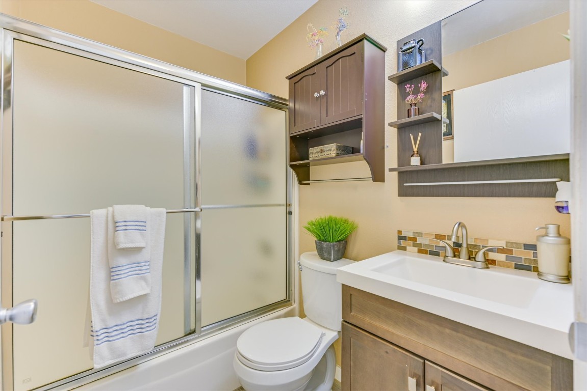 2201 Tallow Court Austin, TX 78744 - Photo 15 of 21 a bathroom with a sink a toilet and shower