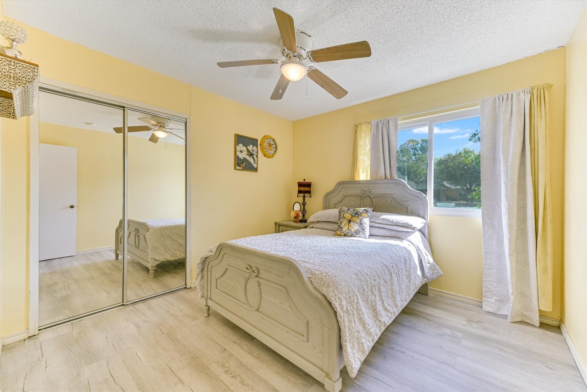 2201 Tallow Court Austin, TX 78744 - Photo 16 of 21 a bedroom with a bed and a large window