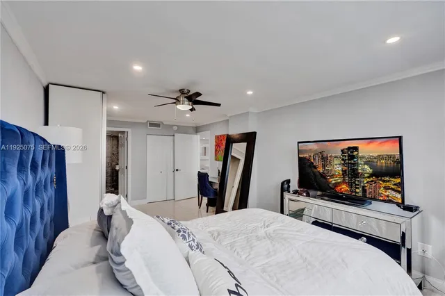 a living room with furniture and large window
