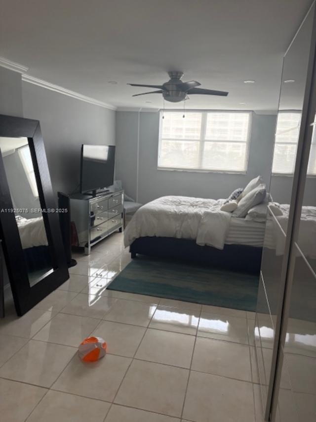 9273 Collins Avenue, Unit 407 Surfside, FL 33154 - Photo 4 of 10 a bedroom with a bed a couch and dresser