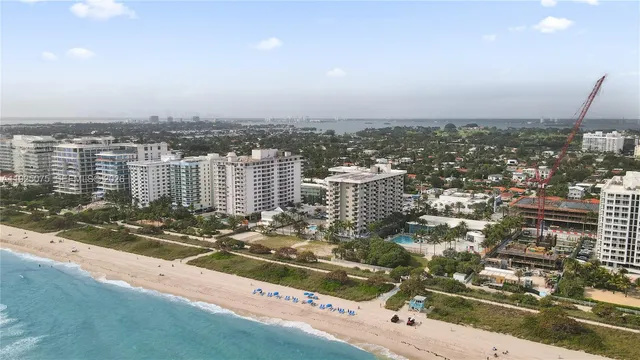 a bedroom with a bed and a flat tv screen on the dresser