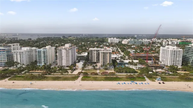 a view of a bathroom with a shower and a sink