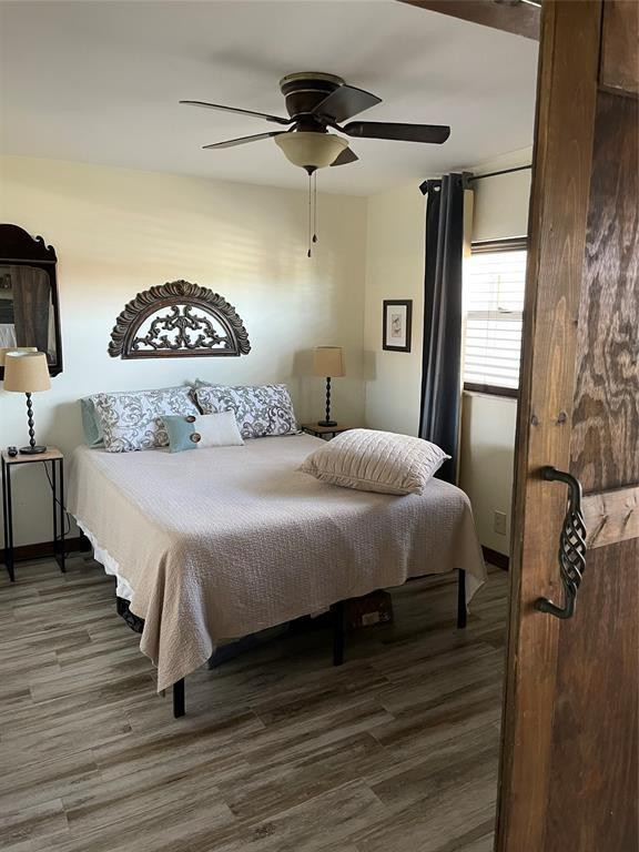 8838 West McNab Road, Unit 201 Tamarac, FL 33321 - Photo 11 of 18 a bedroom with a bed and a chandelier