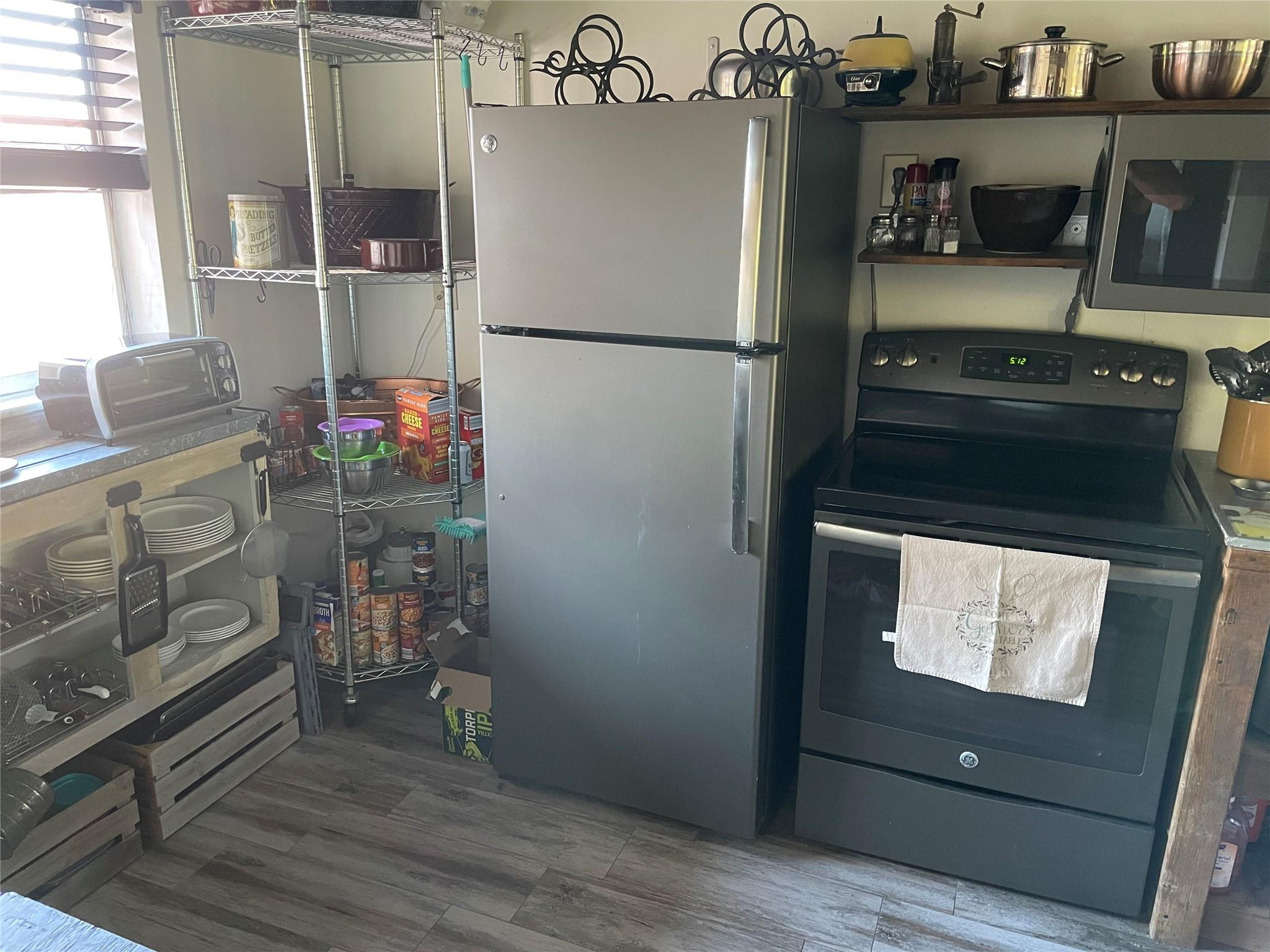 8838 West McNab Road, Unit 201 Tamarac, FL 33321 - Photo 2 of 18 a kitchen with a refrigerator and a stove