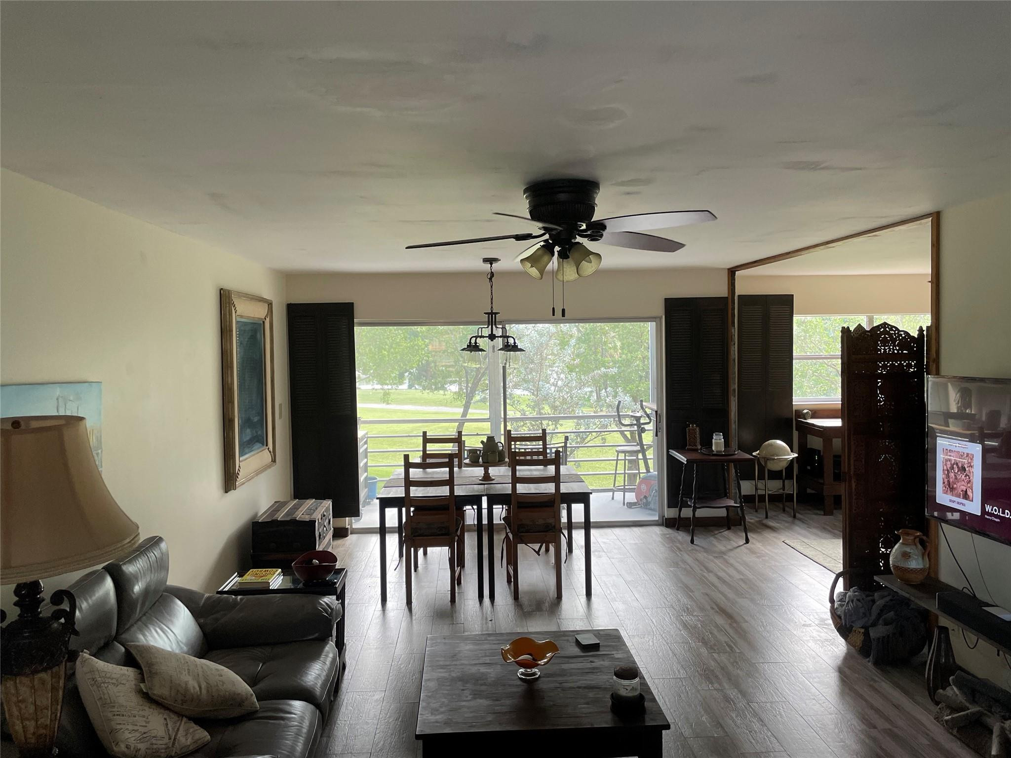8838 West McNab Road, Unit 201 Tamarac, FL 33321 - Photo 4 of 18 a living room with furniture and wooden floor