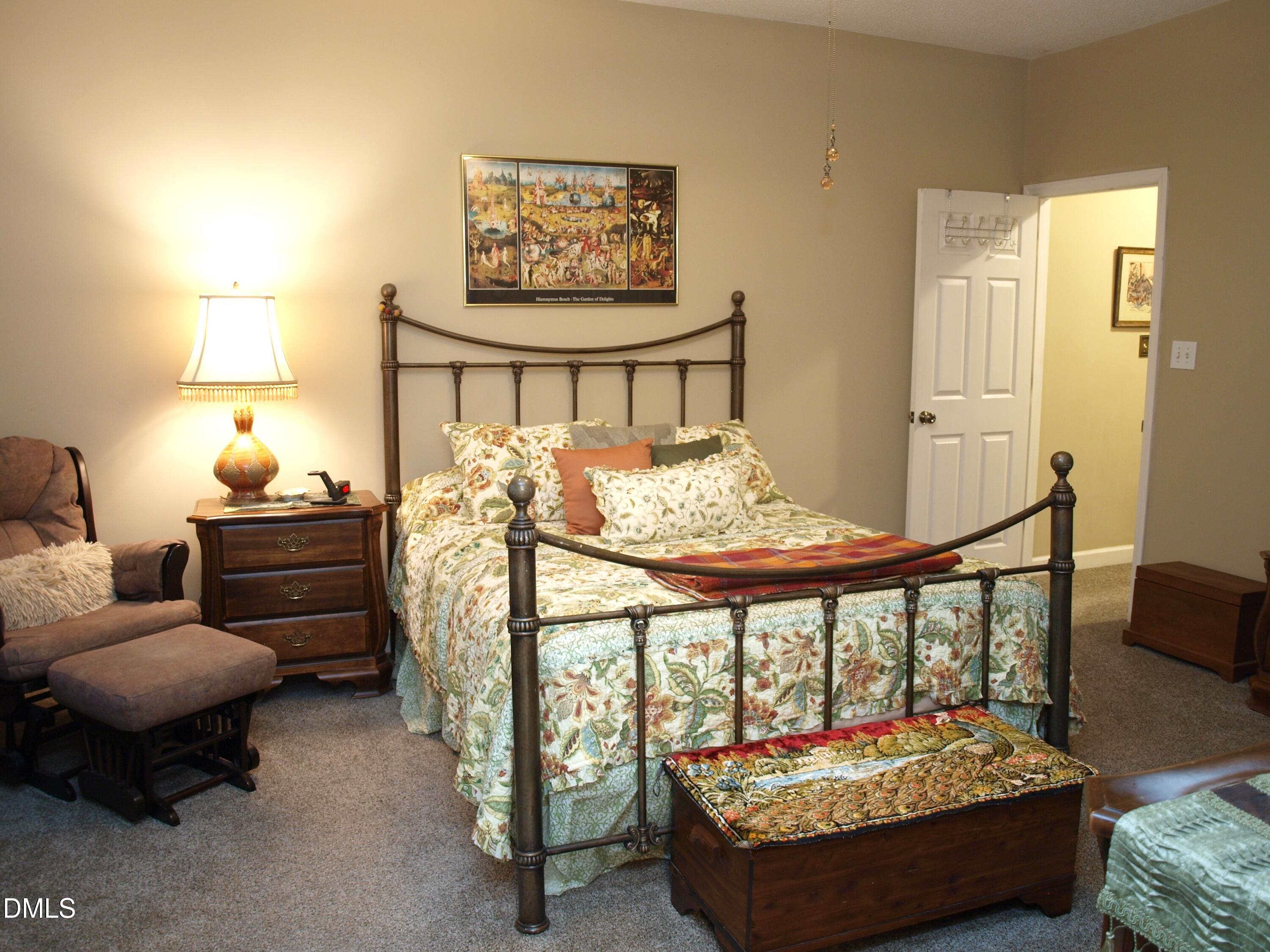 801 Genford Court Raleigh, NC 27609 - Photo 9 of 18 a living room with furniture and a table