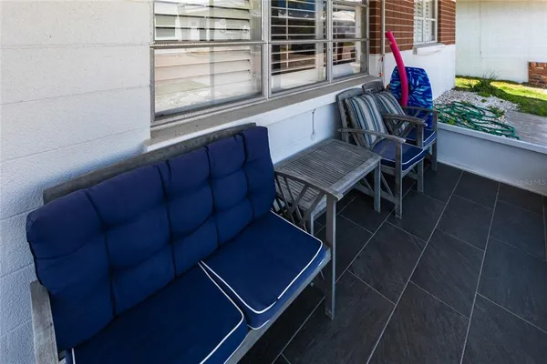 a bedroom with a bed and a night stand