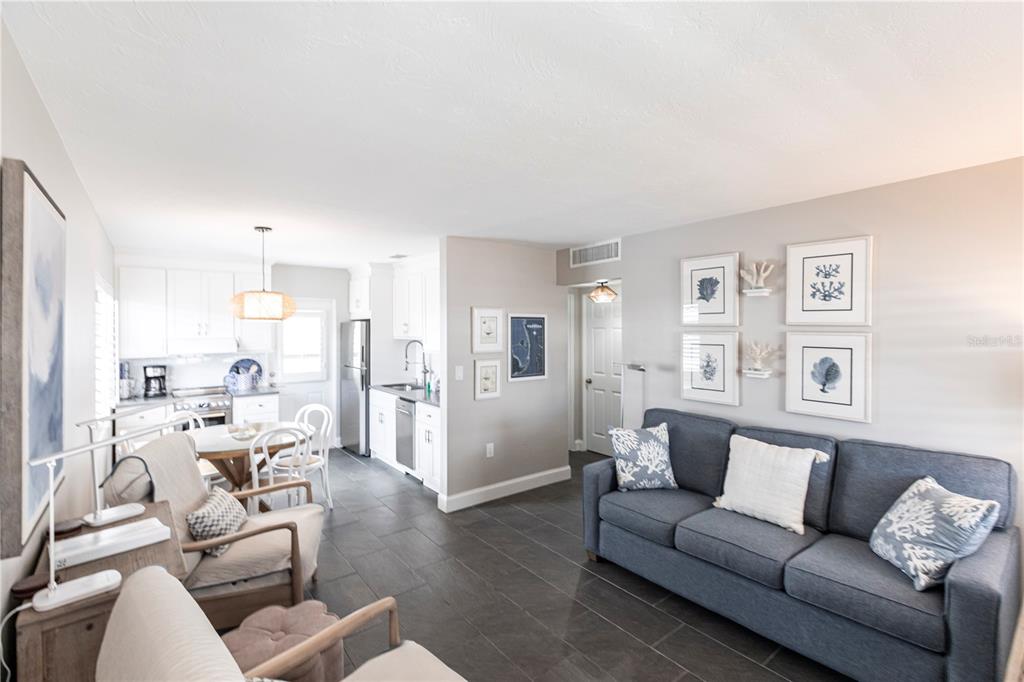 6020 Midnight Pass Road, Unit 31 Sarasota, FL 34242 - Photo 2 of 19 a living room with furniture and a couch