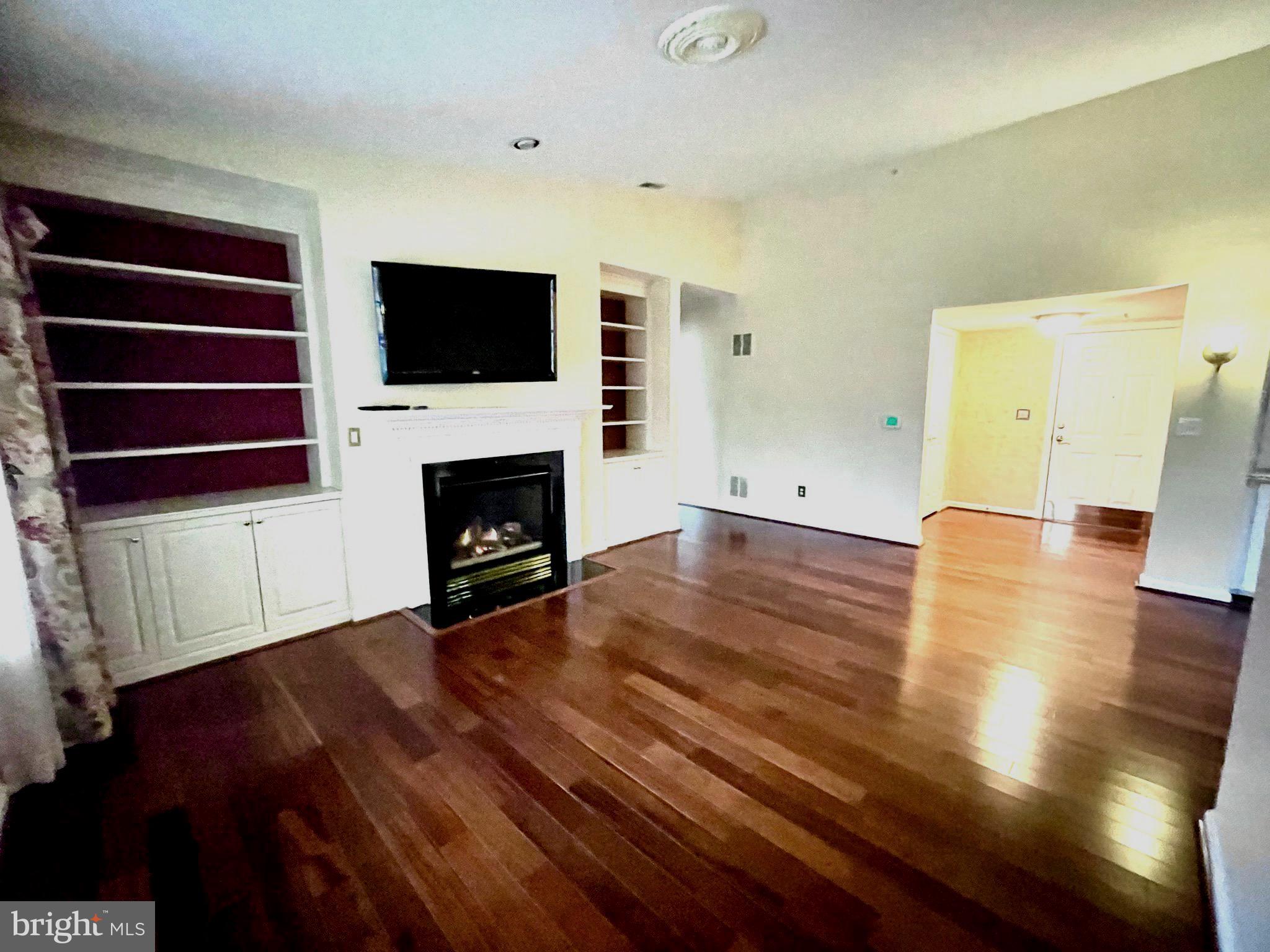 12300 Rosslare Ridge Road, Unit 508 Lutherville-Timonium, MD 21093 - Photo 12 of 63 Living Room with built-in book shelves