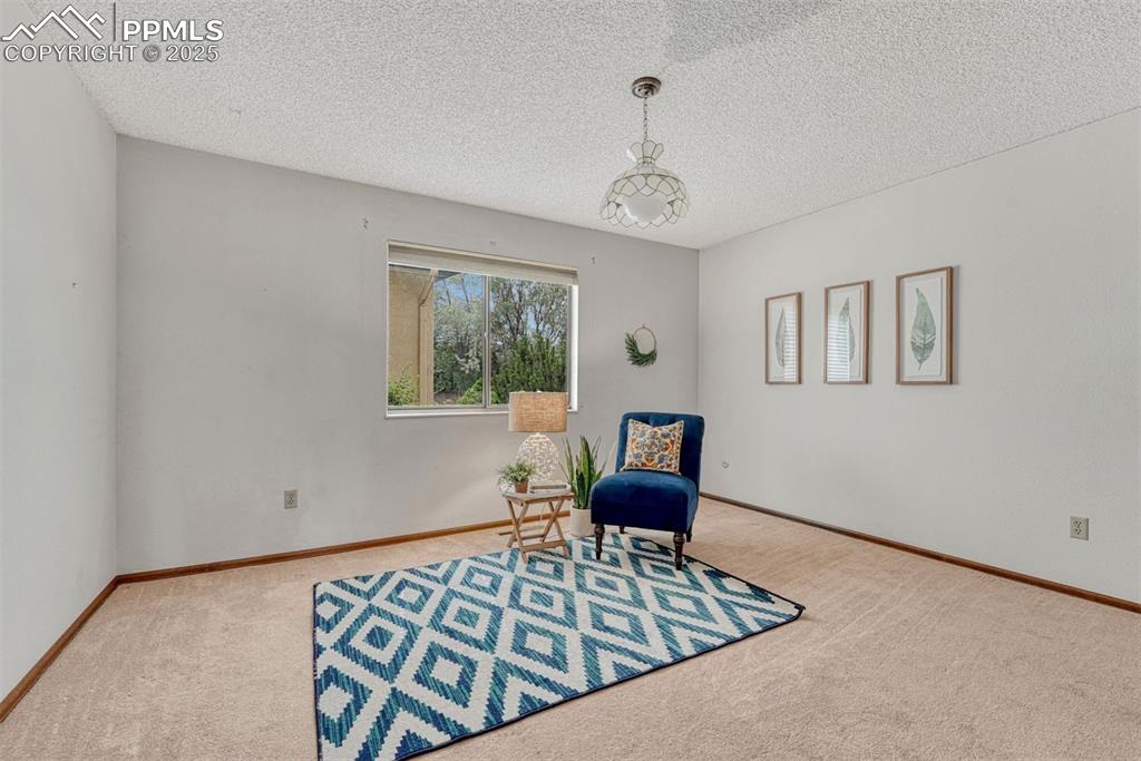 1146 Fontmore Road, Unit A Colorado Springs, CO 80904 - Photo 17 of 26 a bedroom with furniture and a window