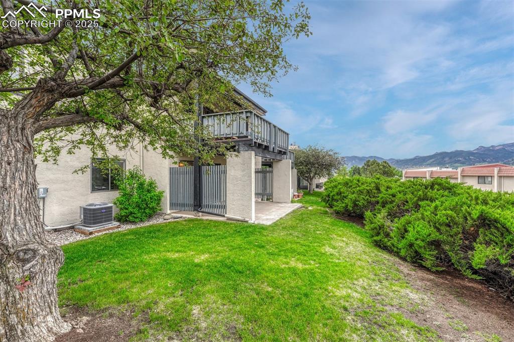 1146 Fontmore Road, Unit A Colorado Springs, CO 80904 - Photo 21 of 26 a view of a house with a big yard plants and large trees