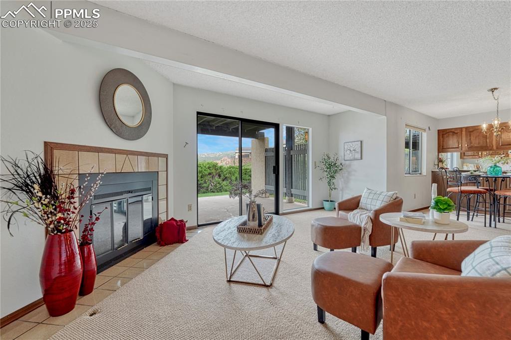 1146 Fontmore Road, Unit A Colorado Springs, CO 80904 - Photo 4 of 26 a living room with furniture and a fireplace