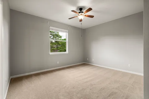 a bedroom with a bed and a table