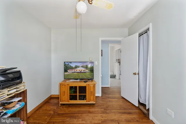 a room with furniture and wooden floor