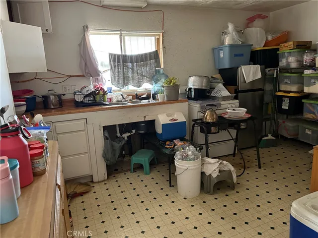 a bed room with a bed and a chair