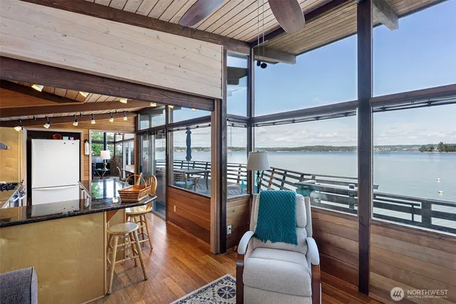 a view of a balcony dining area with furniture